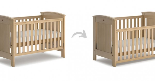 Crib with outlet adjustable side